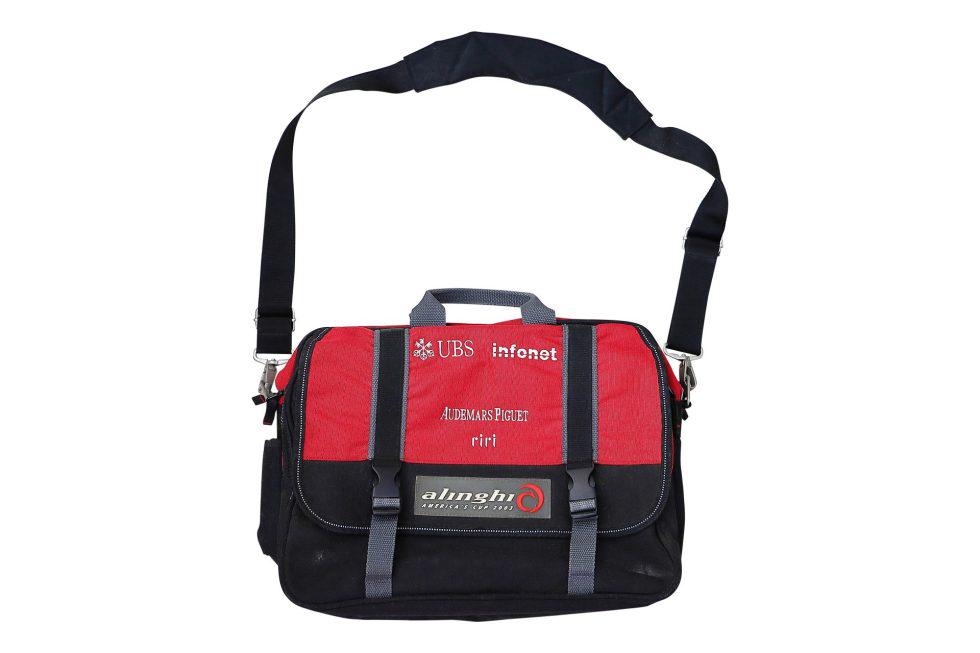 Audemars Piguet Alinghi Americas Cup Messenger Bag: Artist: Audemars Piguet Title: Alinghi Americas Cup Messenger Bag Condition Report: Has areas of wear, scuffing, and discoloration throughout due to normal usage, storage, and age. Overall
