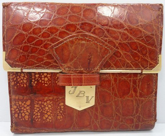 Vintage Patek Philippe Alligator or Crocodile Walle: Rare vintage Patek Philippe alligator or crocodile billfold wallet with various slots for different currencies or denominations. Also has a clear pocket for storage of your ID card. The gold tone trim