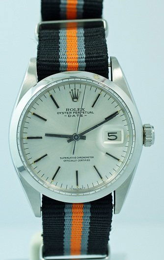 Stainless Steel Rolex Oyster Perpetual Date Watch #: Men`s stainless steel Rolex Oyster Perpetual Date wristwatch, ref #1500, circa 1967. Silver dial with bar hour markers. It comes on a NATO regimental strap. The case diameter is approximately 37mm wit