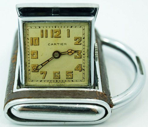 Cartier Travel Purse Watch with Concealed Dial: Cartier travel purse "Hermetic" watch with concealed Cartier dial, 15 jewel Mido Limited movement. Nice patina dial with Arabic numerals. The leather wrapping on the case shows some wear around the ed