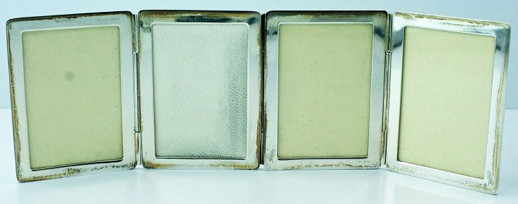 Tiffany & Co Sterling Silver Fold Out Picture Fram: Vintage sterling silver Tiffany & Co. fold out picture frame with four frames. It comes with a Tiffany & Co pouch. The frame is stamped "Tiffany & Co." and "Sterling." The approximate weight is 2.5 tr