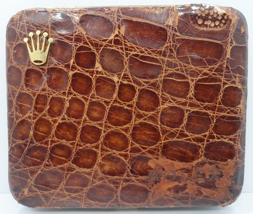 Vintage Rolex Cigarette or Small Cigar Case: Vintage Rolex cigarette or small cigar case alligator or crocodile cover with gold tone trim. Overall good condition for the age. Inside sticker reads "GABRIELLE RICHARD 10.RUE D`ALGER PARIS."