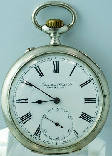 Silver Open Face IWC Pocket Watch: Open face IWC (International Watch Company) silver pocket watch. The case back and cuvette are signed IWC and hallmarked 0.800 indicating silver. The case has German silver hallmarks of a crescent moo