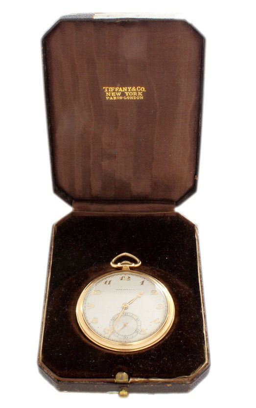 14k Yellow Gold Tiffany & Co Pocket Watch: Vintage 1930`s 14k yellow gold IWC pocketwatch retailed by Tiffany & Co with original box. Silver dial with applied yellow gold Breguet numeral hour markers with sub seconds. The movement is marked In
