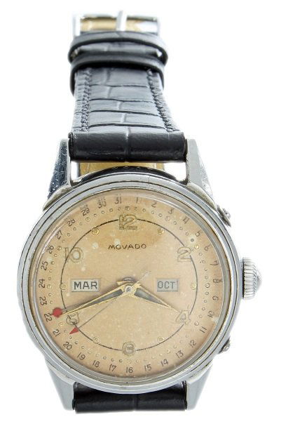 Stainless Steel Triple Calendar Movado Watch: Stainless steel Triple Calendar Movado wristwatch with screw back case. Side pushers for quickset advancement of the date hand and month aperture. Older refreshed dial with patina. Calendar dial with