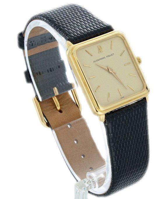 Gents 18k Yellow Gold Audemars Piguet Watch: Men`s 18k yellow gold Audemars Piguet rectangular wristwatch. Swiss made, quartz movement. The inside of the 18k yellow gold case back is stamped Audemars Piguet & Co. Swiss 18k and 296 which we belie