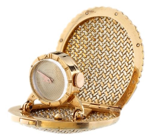 18K Universal Geneve Tri-Color Gold Diamond Pendant Wat: Unusual 18k tri-color gold Universal Geneve pendant watch in the style of Cartier workshops. The clam shell shaped travel clock has a basket weave design and is decorated with diamonds around the edge