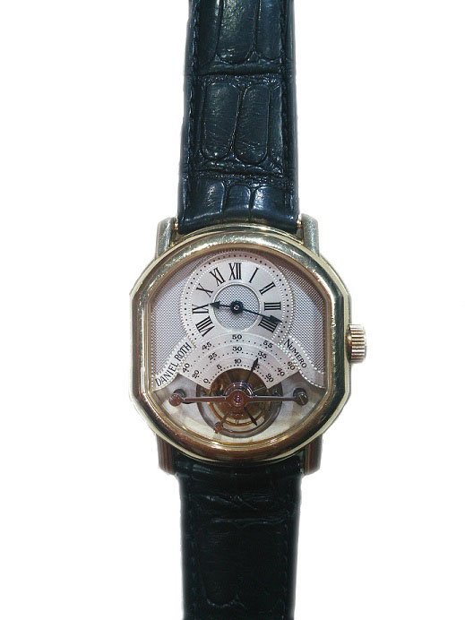 18k Yellow Gold Daniel Roth Tourbillon Watch: 18k yellow gold Daniel Roth Tourbillon Regulateur wristwatch, Swiss made, black strap with 18k yellow gold deployant buckle.