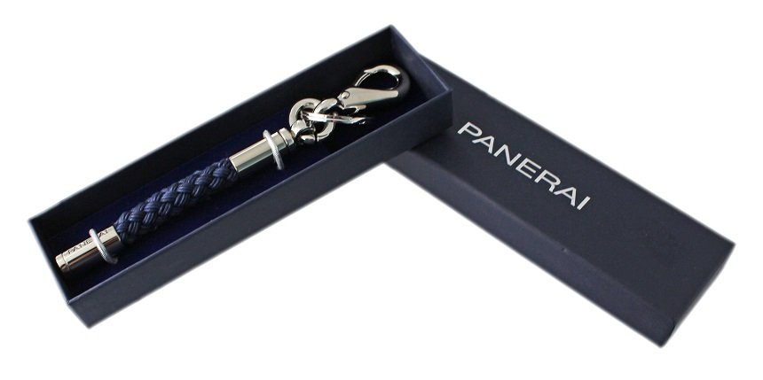 Large Panerai Key Ring with Box: Nautical Panerai key chain holder with a navy blue braided rope cord body. Approximately 180mm long. Accompanied with original Panerai fitted box.