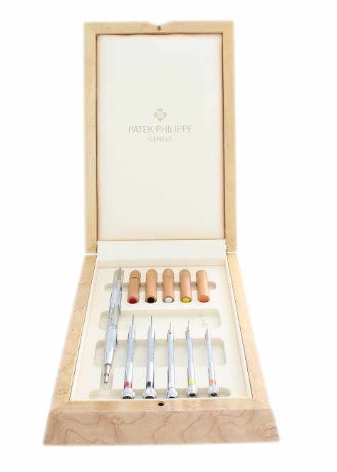 Patek Philippe Watch Tool Set With Box: Hard to find Patek Philippe wristwatch screw driver set and band/bracelet pin removal tool. Complete with extra screwdriver tips in their own container. Encased in a nice wooden Patek Philippe box.