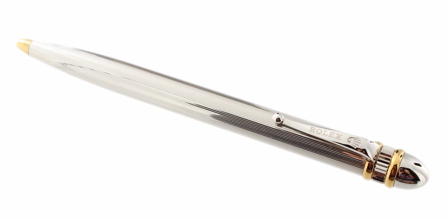 Rolex Ballpoint Pen: Rolex ballpoint pen, silver color with gold tone accents. Blue ink. Nice heavy weight.