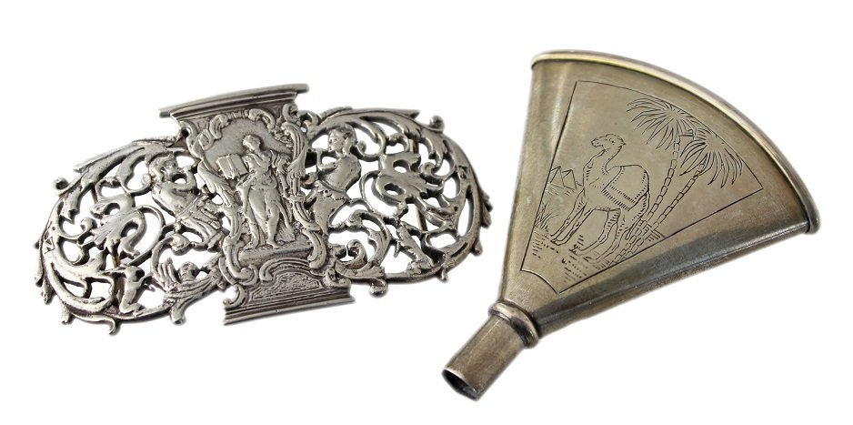 Continental Silver Belt Buckle and Sterling Silver: A continental silver belt buckle with pierced scrolling decoration, marked J star P, and a sterling silver funnel by Webster Company engraved with a desert scene of a camel, palm trees, and pyramids.