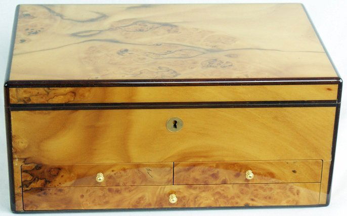 Audemars Piguet Large Wood Grain Presentation Watch Box: Large wood grain Audemars Piguet presentation watch box. The inside is lined with green suede. The top tray is removable and has a removable suede cover. The center has two removable pullout trays. Ea