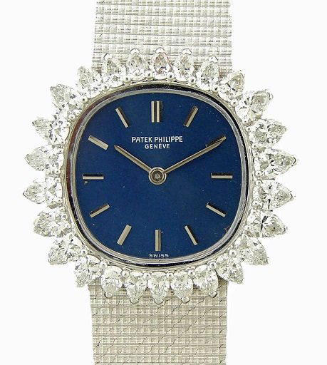 18K White Gold Ladies Patek Philippe Watch with: Vintage ladies 18k white gold Patek Philippe wristwatch, blue Patek Philippe dial with white gold hour markers, bezel has 26 pear shaped diamonds, Swiss made, manual wind movement, snap back, comes on