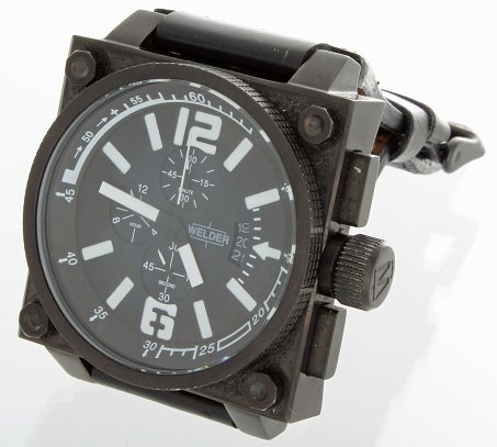 Ion Plated Steel Welder K23 U-Boat Watch With Box: Ion plated steel 316L Welder K23 wristwatch with white indexes. Right handed chronograph, water resistant up to 5 ATM design by the U-BOAT founder. Quartz movement. It comes with Welder carrying case.