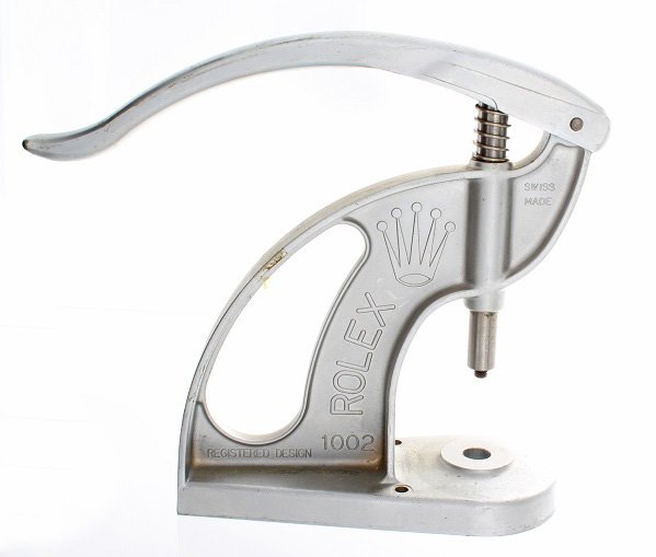 Rolex and Tudor Bezel and Crystal Watch Tool Press Ref: Rolex watch tool press, reference #1002, to fit Rolex and Tudor Oyster bezels and bezel-rings for revolving bezels. Mountable with 2 screws on a desk or workbench. Swiss made. In very good overall con