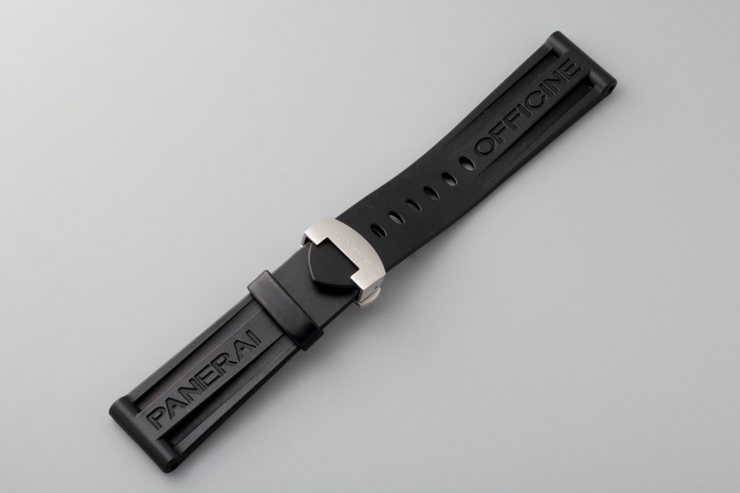 Officine Panerai Rubber Watch Strap with Deployant: Black rubber Panerai wristwatch strap with a stainless steel Panerai deployant buckle. Swiss made. Fits 24mm lug size Panerai wristwatches. Approximately 175mm in length. The buckle is stamped Officin