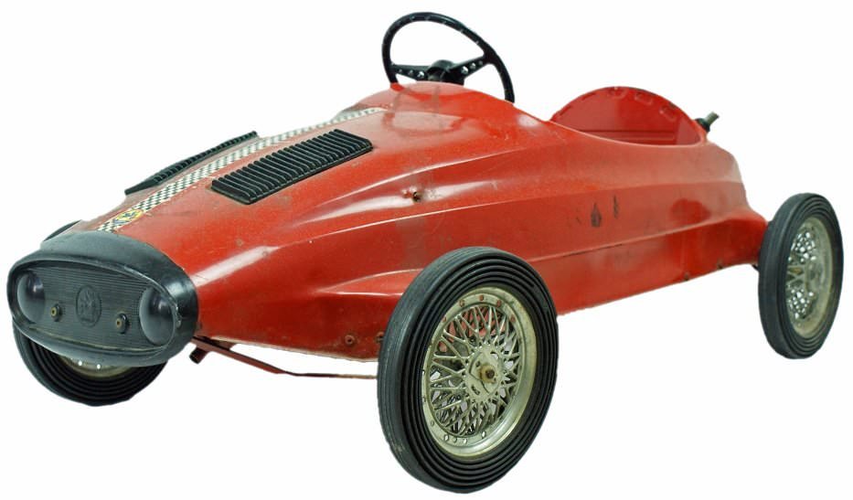 Vintage Ferrari Pressed Steel Child`s Toy Pedal Car by: Vintage Ferrari pedal race car by Giordani in pressed steel, probably from the 1950`s. Esso sticker on top of gas cap (international trade name for Exxon Mobile from 1950`s to the early 1970`s). Leath