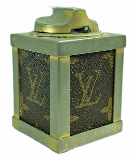 Vintage Louis Vuitton Table Lighter: Very rare and fine Louis Vuitton table lighter. In good condition with nice patina. The lighter needs fluid. The Louis Vuitton label was founded by Vuitton in 1854 on Rue Neuve des Capucines in Paris,