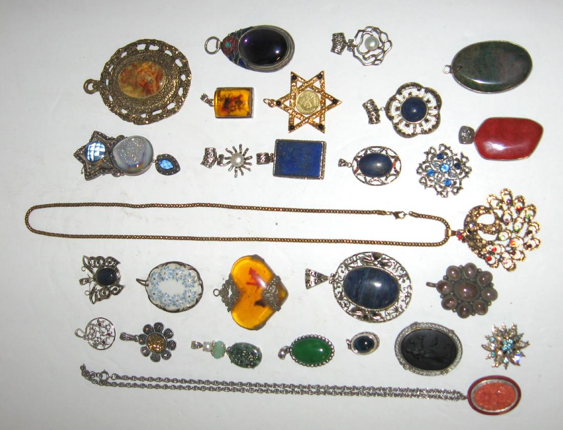 Group of costume jewelry pendants,: Approx. 27 pendants including faux and natural stones. Condition: commensurate with age..