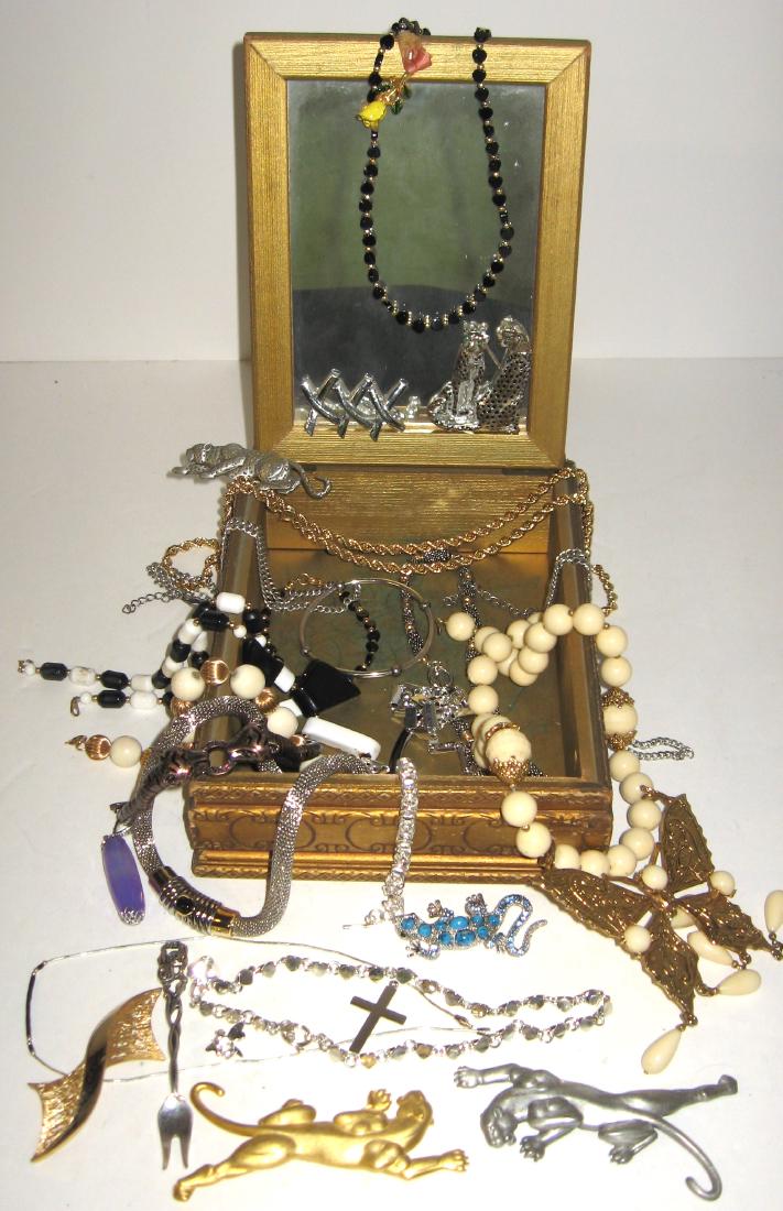 Costume jewelry and box,: Including three Jonette Panther pins, tiger bangle, and butterfly pendant marked Sul. Condition: good, commensurate with age.