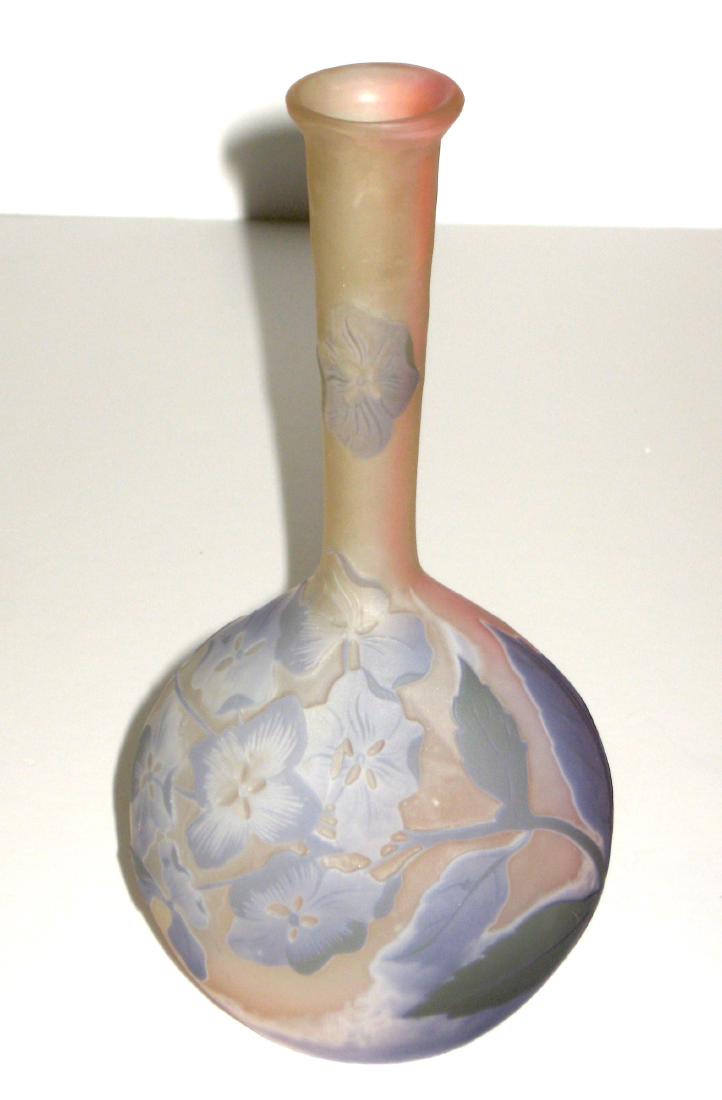 Galle French cameo glass vase: Banjo form in frosted pink glass decorated with lavender flower and leaves signed in cameo Galle, 7' ht. Condition: good with no chips cracks or repairs.