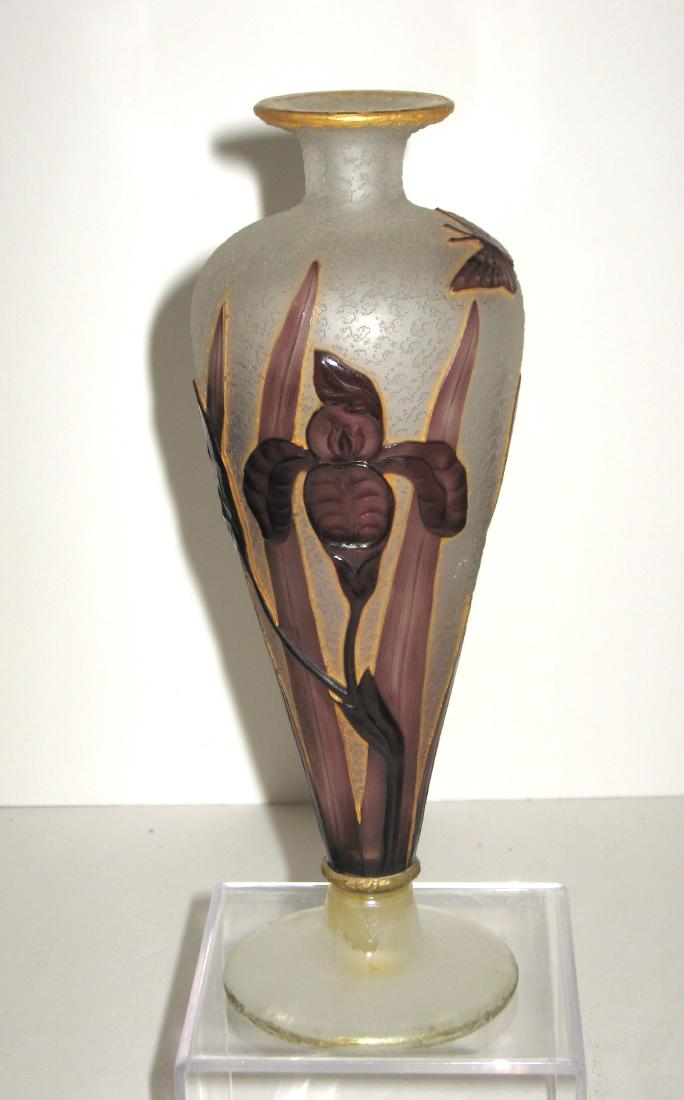 Daum Nancy French cameo glass vase,: Footed urn form in textured glass decorated with purple wheel carved flowers and leaves, reverse with butterflies, accented with gilt highlights, engraved signature Daum Nancy, 9" ht. Condition: profe