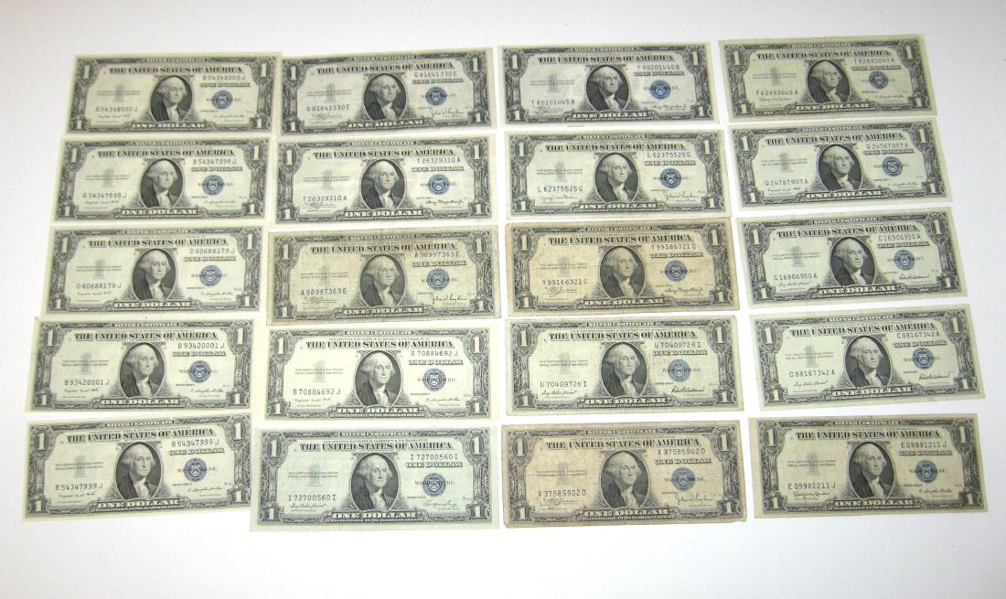 20 1935 and 1957 One dollar bills,: Including 10 excellent 1935 blue seal, with six good 1935 blue seal and four very good 1957.