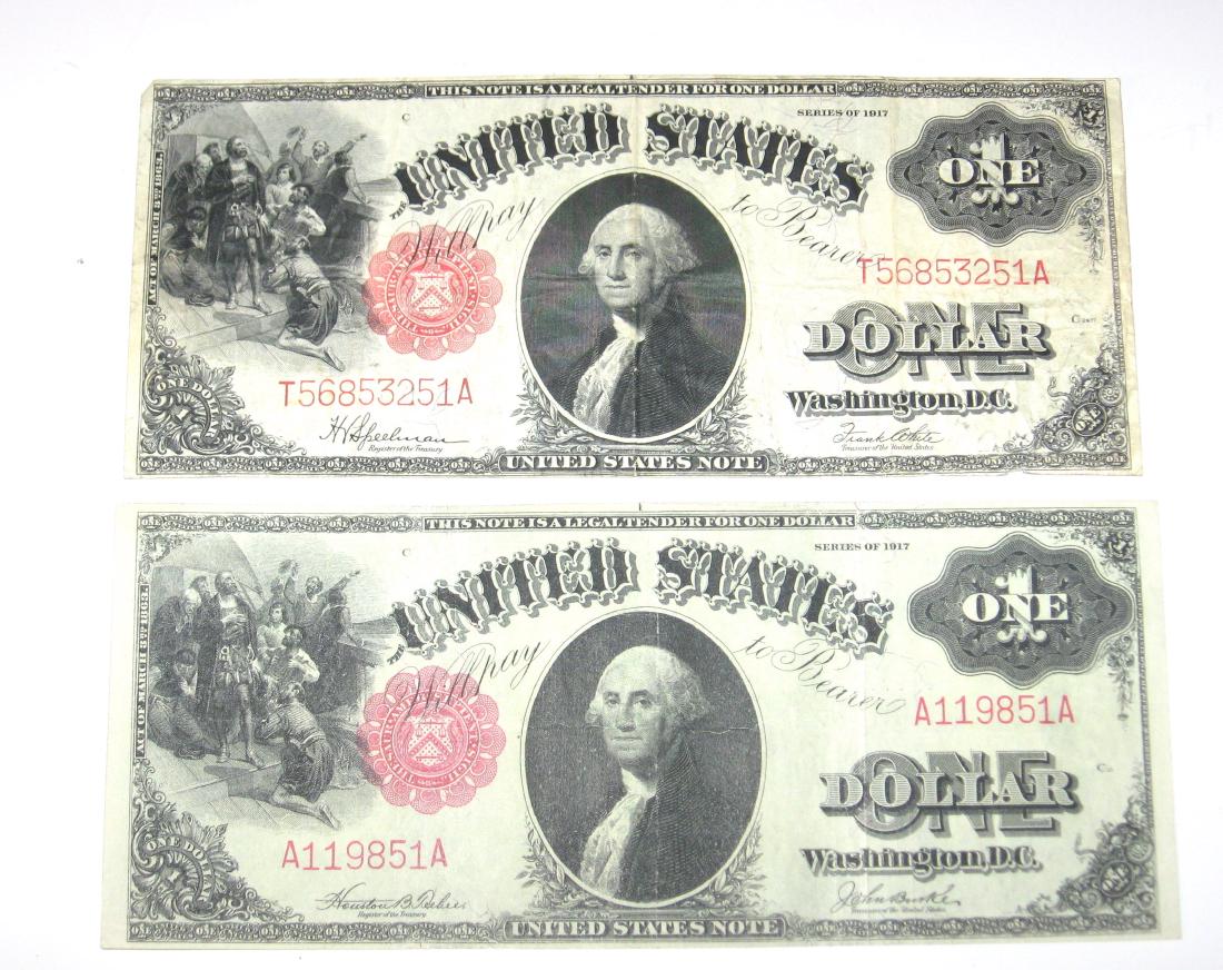 Two 1917 large size one dollar bills,: Large size red seal one dollar bills with one signed Burke and low A number. Condition: good to excellent