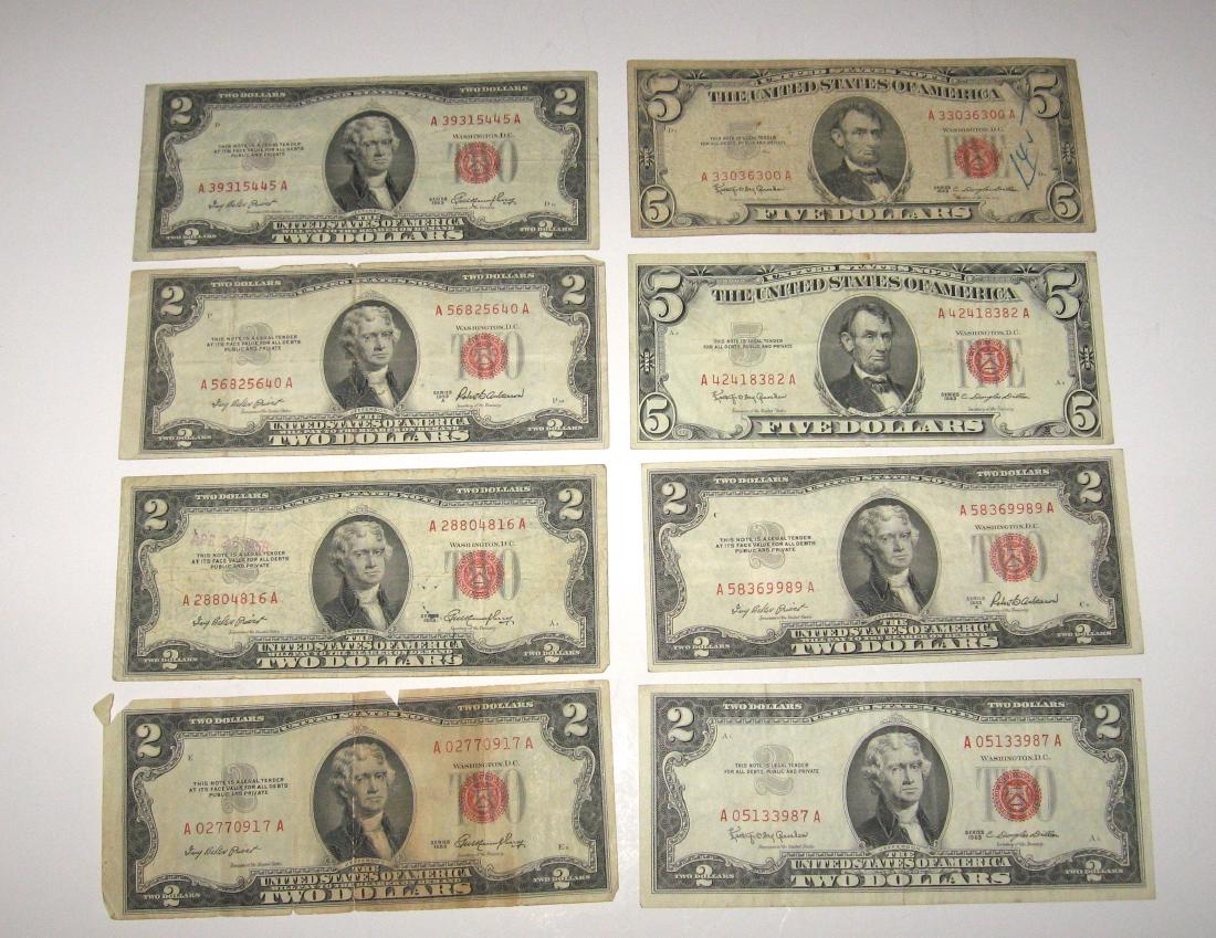 Group of US red seal currency: Including two 1953 2$ dollar bills, 4 1953 red seals 2$ bill, two 1963 5$ red seal bills. Condition: good with ware to some