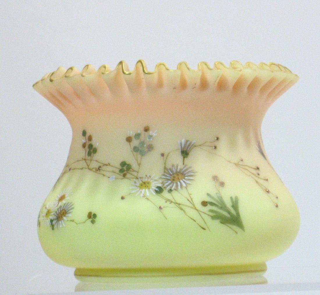 Mt. Washington Burmese ruffle rim sugar bowl: Ovoid bowl with a tight crimped gold highlighted top decorated with gold stems of white and gray daisies, 3 1/2" ht. Condition: good with no defects found