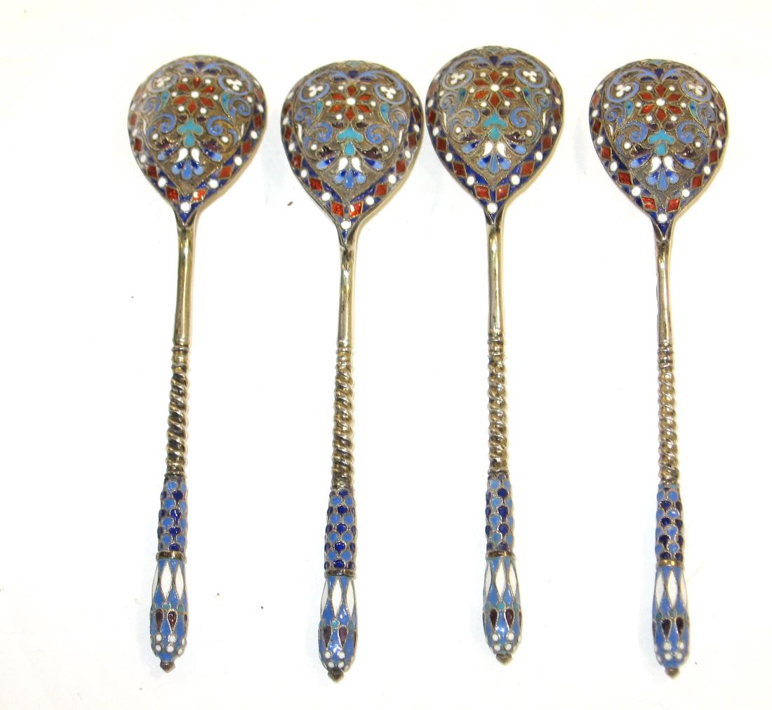 Four Gustav Klingert Russian spoons: Four Russian spoons with enameled scrolling and crown handles, marked A.A. 84 GK, 5 1/2" long. Condition: good with no defects found.