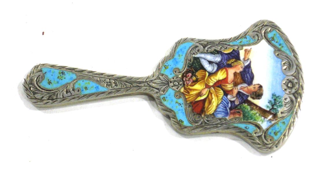 Italian Silver and enameled mirror,: Blue enamel and scrolling silver with central medallion of a courting couple, marked 800, 4" long. Condition: good with no defects found.