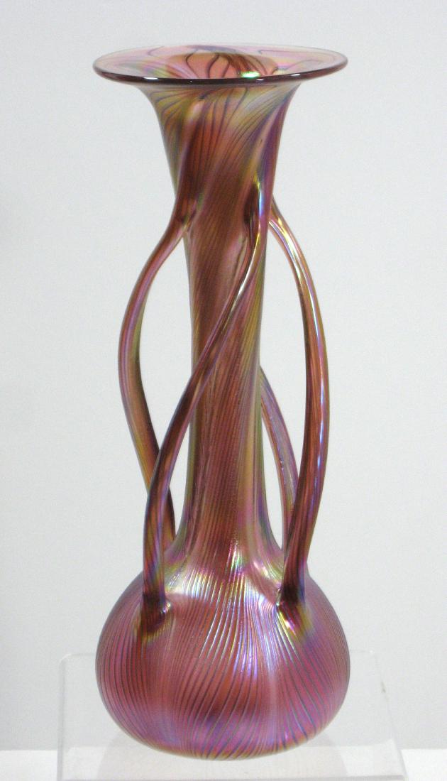 Czech contemporary art glass vase,: Bulbous trumpet form in red glass decorated with four twist side handles, 12" ht. Condition: good with no defects found.