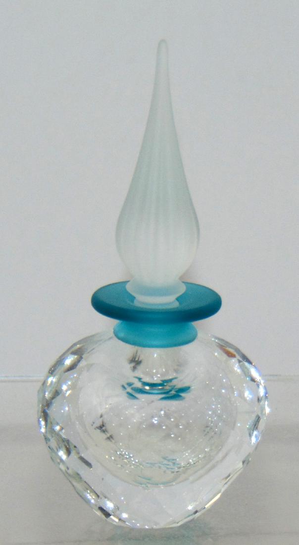 Swarovski cut glass perfume bottle,: Ovoid bottle with a frosted tear drop stopper, marked with the frosted swan factory mark, 4 1/2' ht. Condition: good with no defects found.