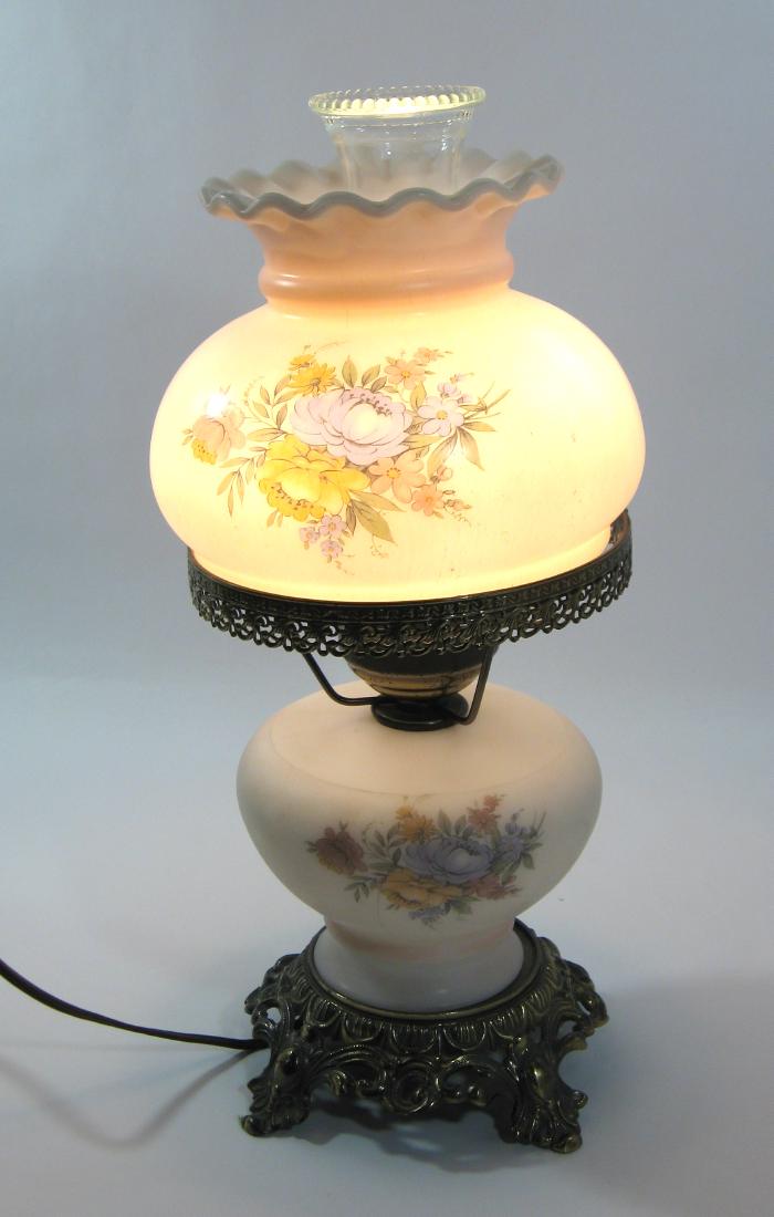 Gone with the Wind lamp,: Mid 20th century lamp in pink and opaline glass decorated with a colorful flower transfer, lights on bottom and top 17" ht. Condition: good with no defects found.
