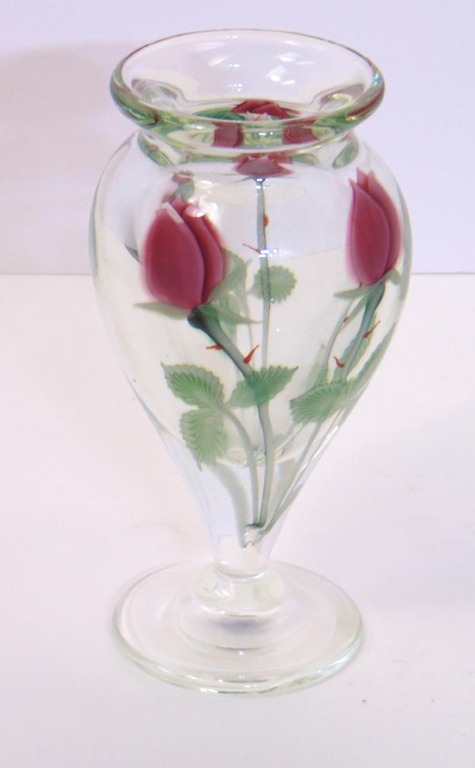 Orient and Flume glass vase: Footed urn form in translucent glass decorated with pink roses, marked O&F 5067iI3 and carries a paper label, 7 3/4" ht. Condition: good with no defects found.