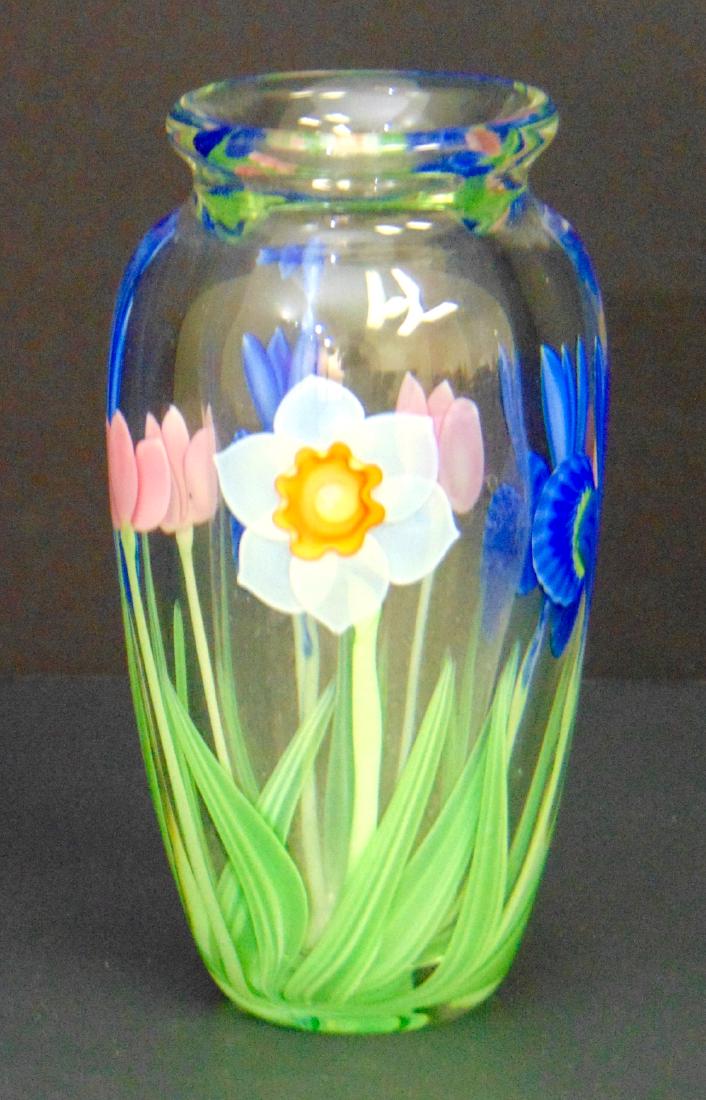 Orient and Flume glass vase: Cylindrical in translucent glass decorated with blue iris, pink tulips and white daffodils, marked OF and numbered, 7" ht. Condition: good with no defects found.