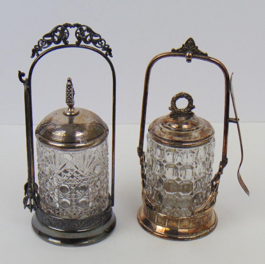 Daisy and Button glass pickle castor: Including a Daisy and Button in a in a Meriden caddy, together with a Waffle block in a Reed and Barton caddy, tallest 10" ht. Condition: good with no defects found