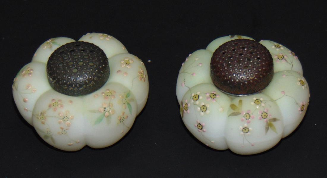 Pair of MW tomato salt shakers: Lime green shakers decorated with white daisies adorned with stippled lids, 2 1/2" wide. Condition: good, but with one lid stuck