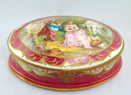 French porcelain dresser box: Large ovoid form in red and white porcelain decorated with a gilt scrolling framed medallion of a courting couple, artist signed Mallet for Jean Baptiste Mallet 1759-1835, factory back stamp believed