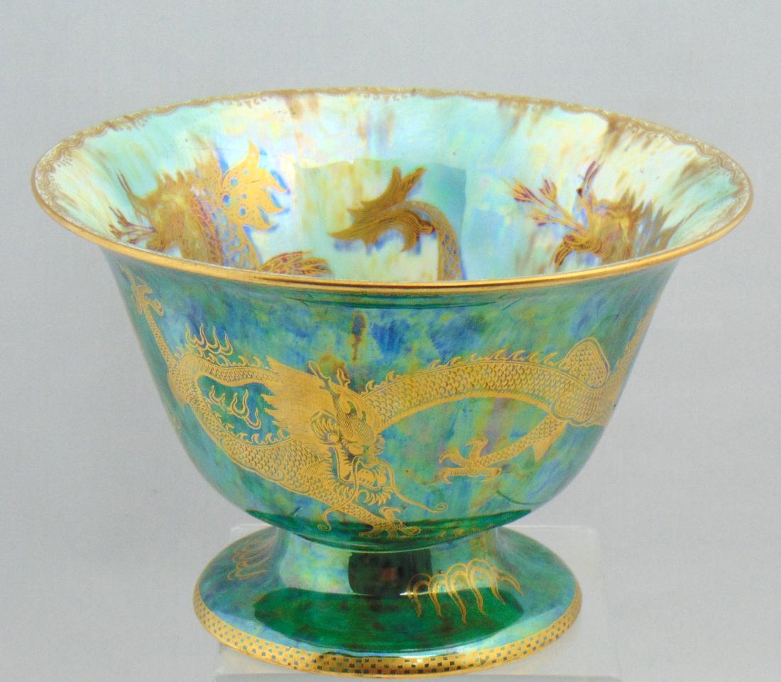 Large Wedgewood Fairyland Lustre: Footed Dragon Lustre bowl in green glaze with an internal central Moorish medallion surrounded with Three flying dragons, 8 1/2" wide by 5 1/2" ht. Condition: good with no defects found.