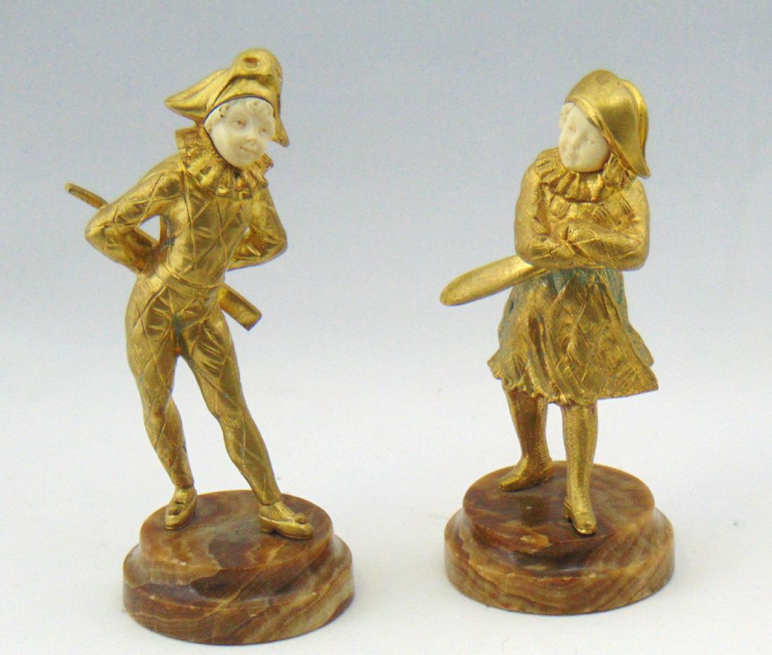 Pair of Chiparus bronze sculpture figurines: Each sculpture of a Continental child in period clothing with weapon toys, each marked Chiparus, 7 1/2" ht. NOTE: we are not experts in this area please make you own decision on quality, material and 