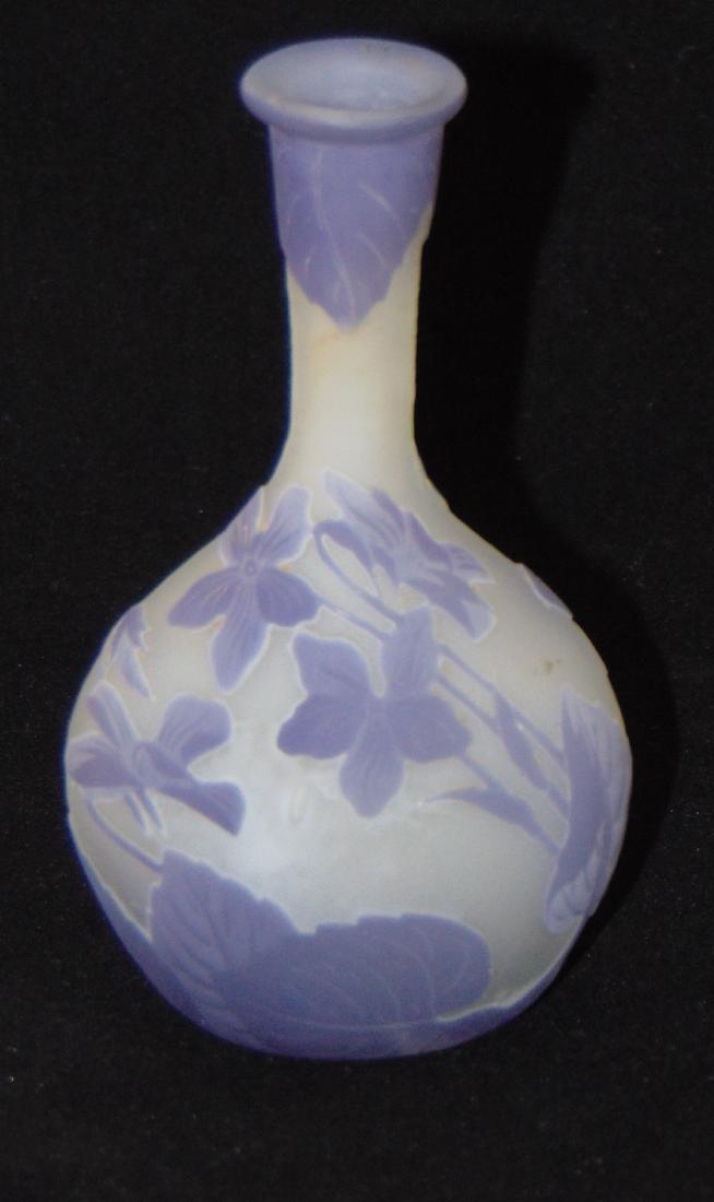 Diminutive Galle Cameo glass vase: Diminutive banjo cameo glass vase in frosted glass decorated with a purple over white leafy stem flower, signed in cameo Galle, 4 1/2" ht. Condition: good with no defects found