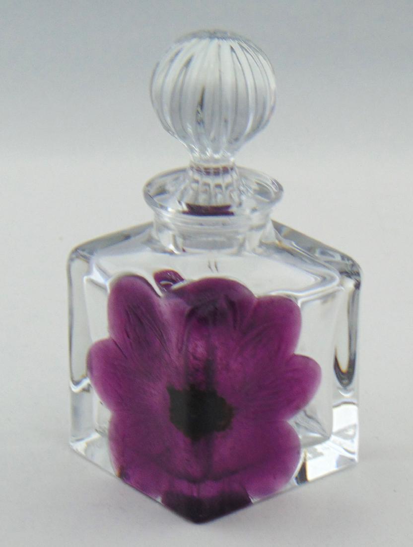 Daum Nancy glass perfume: Rectangular form in clear glass decorated with a purple marquetry flower, signed Daum France, 5 3/4" ht. Condition: good with no defects found.