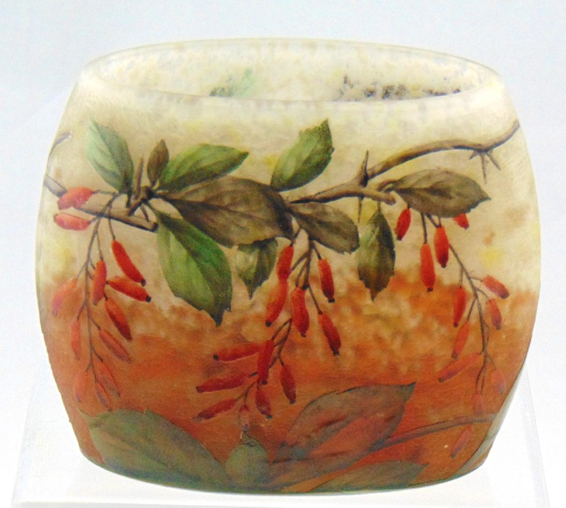 Daum mottled pillow glass vase: Mottled orange and opal decorated with red berry clusters hanging from green leafy branches, signed in cameo Daum Nancy, 4 3/4" long by 3 3/4" ht. Condition: good with no defects found.