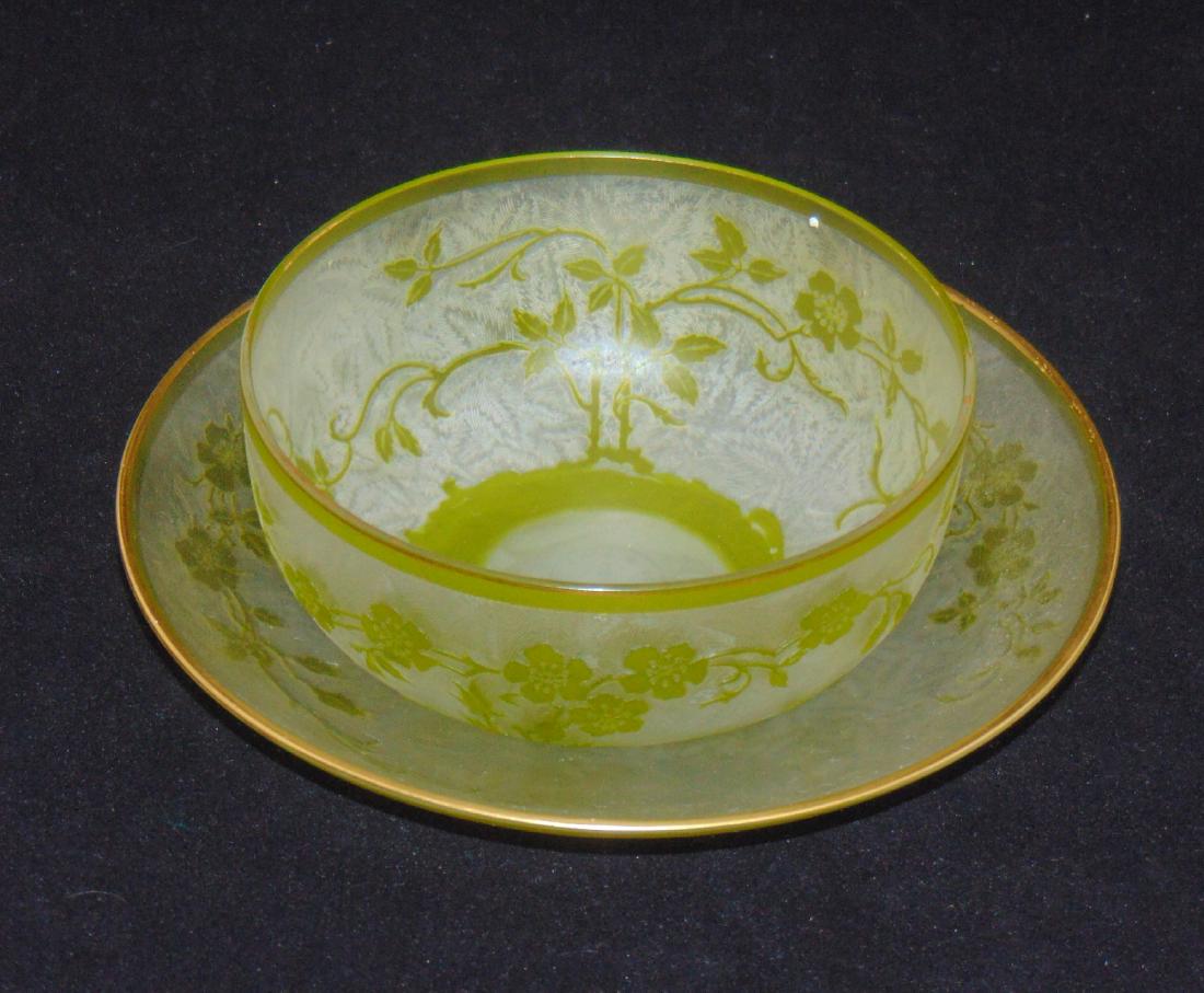 Webb cameo finger bowl and underplate: Frosted etched finger bowl and underplate carved with a random green branch, both with Thomas Webb and Sons acid stamp, 6 1/2" wide. Condition: good with no defects found