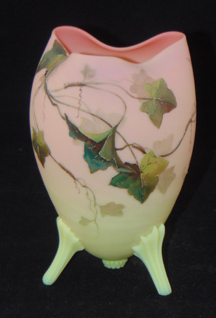 Burmese Oak leaf Footed Glass Vase: Mt. Washington satin finished Burmese egg form vase with three applied feet decorated with oak leaves signed with a Thomas Webb acid stamp, 7" ht. Condition: good with no defects found