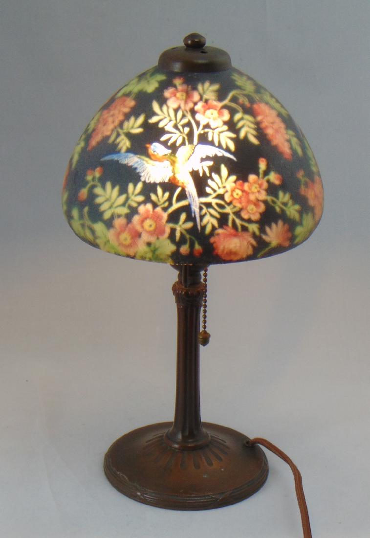 Handel Boudoir glass and bronze lamp: Rare Handel "Jungle Bird" boudoir lamp, black shade with four exotic birds set on colorful foliage, shade double signed Handel and Handel 6905, 13" ht. Condition: good with no defects found.