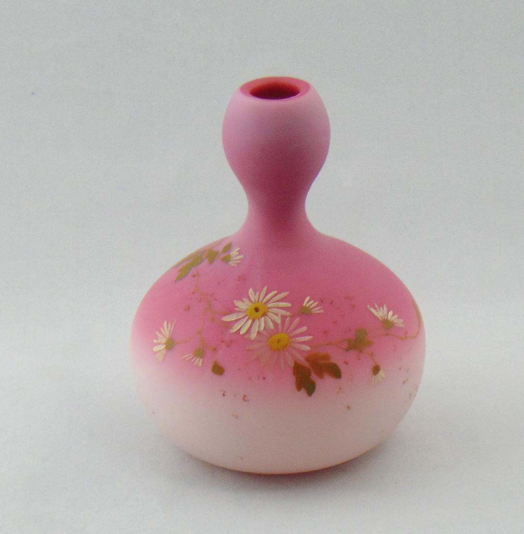 Decorated Peachblow Glass Vase: New England bulbous Peachblow bud vase decorated with stemmed white daisies, 5 1/2" ht. Condition: good with no defects found.